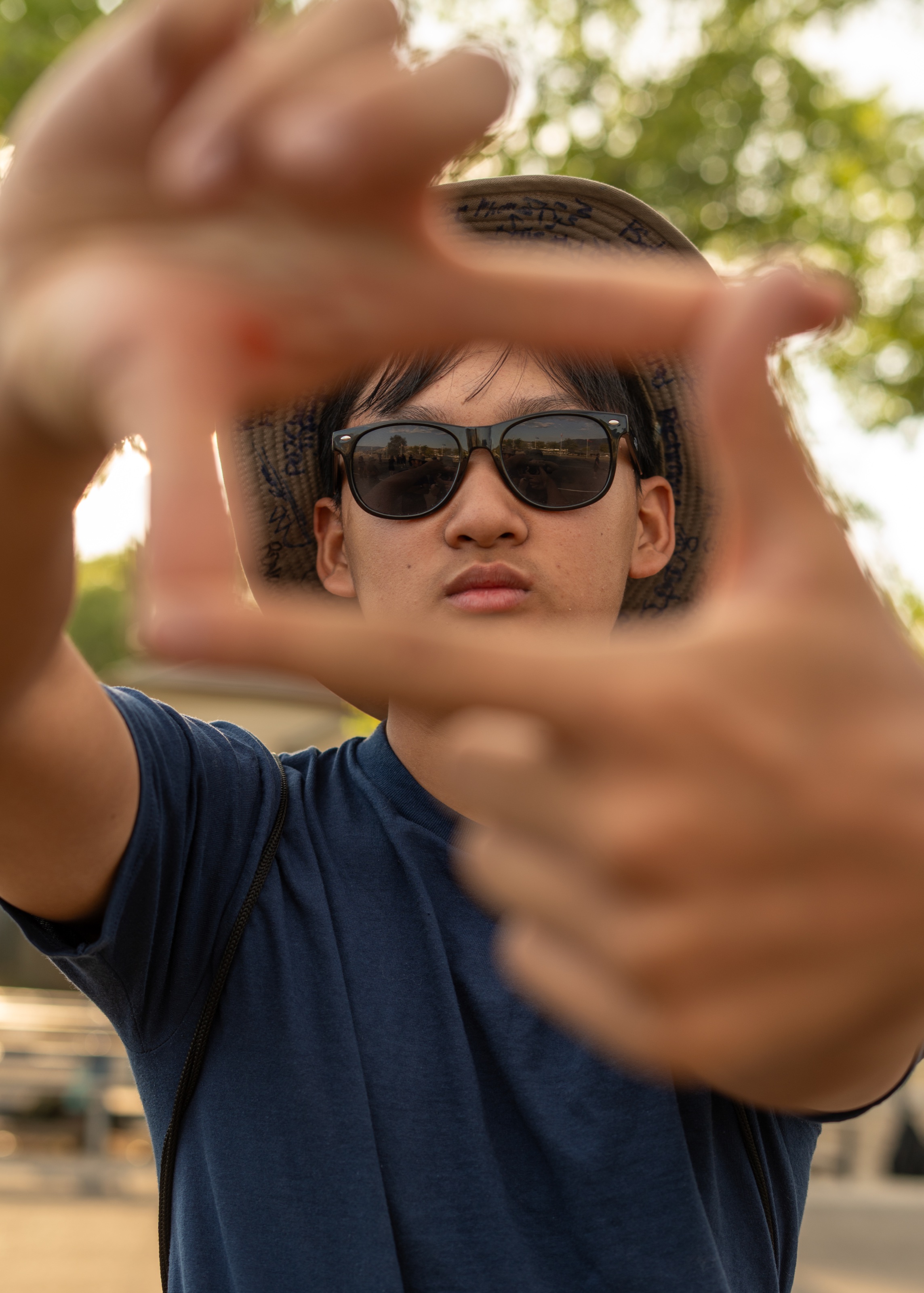 Athlete framed through hands in warm outdoor light
